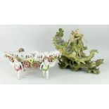 AUSTRIAN PORCELAIN FIGURAL FLOWER BASKET in the form of two figures straddling a sea-shell over a