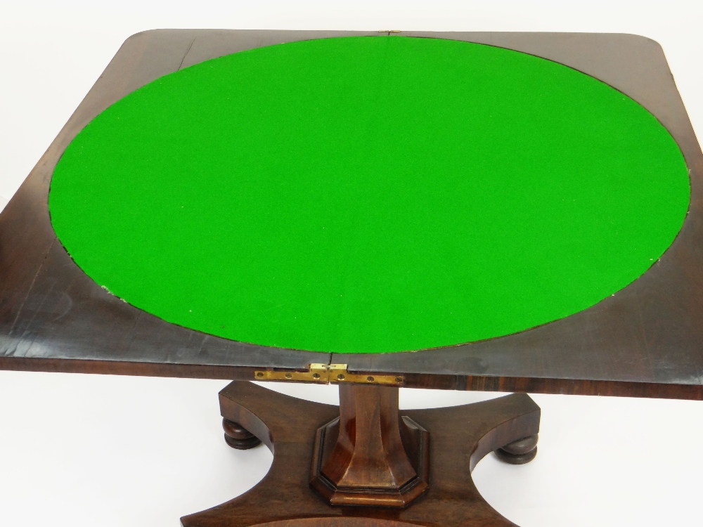 ANTIQUE ROSEWOOD FOLD-OVER CARD TABLE, faceted support on a shaped base with four bun feet, the - Image 3 of 3