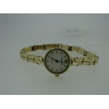 LADIES 9CT YELLOW GOLD BRACELET WATCH by Accurist with white circular dial (spare link) 13gms