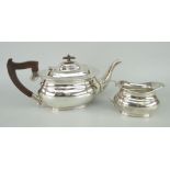 SILVER TEAPOT & MATCHING MILK JUG of bellied oval form, the teapot with composition handle and knop,