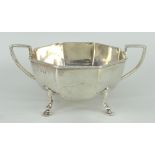 SILVER TWIN-HANDLED SUGAR BASIN of faceted form on hoof feet, London 1918, 8.1ozs