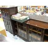 REPRODUCTION TWO DOOR GLAZED BOOKCASE with flanking open shelves in mahogany, and a linen fold