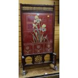 AESTHETIC-MOVEMENT FIRE SCREEN with carved bobbins and open work, the panel with floral upholstery