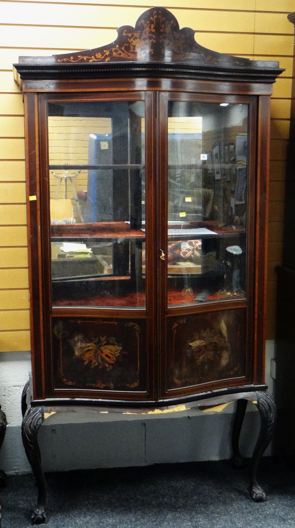 EDWARDIAN SERPENTINE GLAZED BOOKCASE on carved ball and claw supports, for restoration, 213cms high