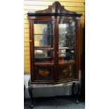 EDWARDIAN SERPENTINE GLAZED BOOKCASE on carved ball and claw supports, for restoration, 213cms high