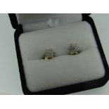 PAIR OF YELLOW METAL DIAMOND EARRINGS with gem specification card
