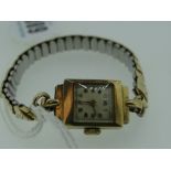 9CT GOLD WRISTWATCH ON BRACELET, in box, engraved 'To Enid from the boys'
