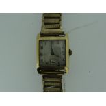 18CT YELLOW GOLD GENTS WRISTWATCH HAVING PLATED STRAP.