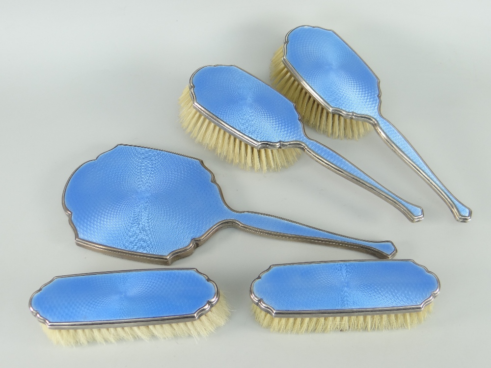 SILVER & GUILLOCHE BLUE ENAMEL FIVE-PIECE VANITY SET comprising pair of hairbrushes, pair of