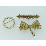 THREE BROOCHES comprising 9ct yellow gold vintage bow-brooch, antique seed-pearl set yellow metal