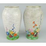 PAIR OF CROWN DEVON FLORAL & RIBBED BALUSTER VASES, 19cms high