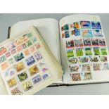 GREEN VINTAGE STRAND STAMP ALBUM & LATER BLACK INTERNATIONAL STAMP ALBUM, green album