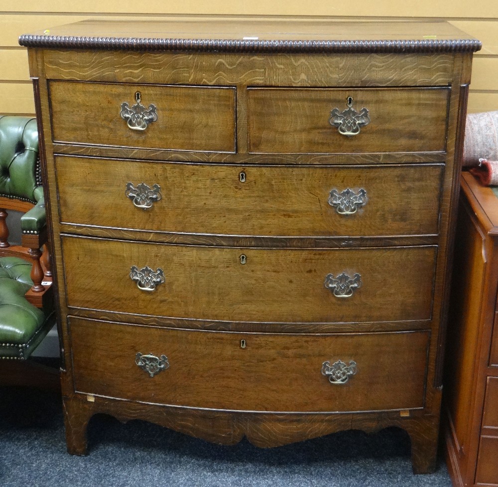 GOOD ANTIQUE BOW FRONT CHEST OF THREE LONG & TWO SHORT DRAWERS, carved detail, brass handles and