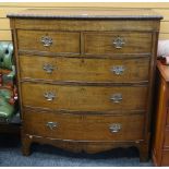 GOOD ANTIQUE BOW FRONT CHEST OF THREE LONG & TWO SHORT DRAWERS, carved detail, brass handles and