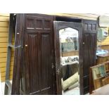 VINTAGE LINEN-FOLD BREAK FRONT WARDROBE, centre mirrored-door opening to linen drawers, flanking