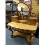 VICTORIAN MAHOGANY DRESSING TABLE having an open platform base with cabriole and scroll supports,