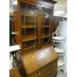 VINTAGE BUREAU BOOKCASE, the upper section with two glazed doors, the base with three drawers,