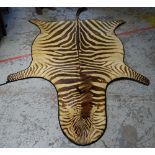 VINTAGE ZEBRA SKIN RUG, approximately 234cms long x 165cms wide