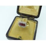 18CT YELLOW GOLD DIAMOND AND RUBY CLUSTER RING in Charles Fish Ltd jewellery box, 3.5gms.