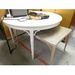 WHITE PAINTED CIRCULAR EXTENDING TABLE on bamboo type supports, together with similar cane work sudo