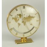 MID-CENTURY KIENZLE TABLE WORLD CLOCK with various country time-zones, raised on a pedestal and with