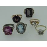 SIX YELLOW AND WHITE METAL SEMI-PRECIOUS STONE SET DRESS RINGS including 9ct gold. (6)