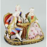 CONTINENTAL PAINTED BISQUE MODEL OF A CHESS GAME with three figures in Regency dress and
