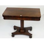 ANTIQUE ROSEWOOD FOLD-OVER CARD TABLE, faceted support on a shaped base with four bun feet, the