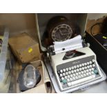 VINTAGE DOME TOPPED MANTLE CLOCK, cased Olympia typewriter and three gas masks