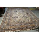 LARGE MAINLY FAWN & BLUE MULTI-PATTERNED PERSIAN RUG with large centre cartouche decoration and