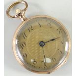 SMALL 9CT YELLOW GOLD PENDANT WATCH having a yellow metal dial bearing Arabic numerals, monogram