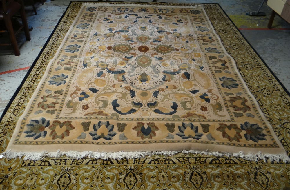 MAINLY GREEN & GOLD GROUND PERSIAN RUG with centre decoration and