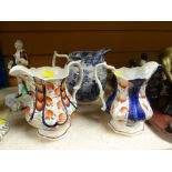 THREE WELSH POTTERY JUGS, two Gaudy Welsh patterned, together with a blue and white Bakers, Bevan