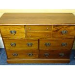 REPRODUCTION MAHOGANY SIDEBOARD CHEST of eight various drawers on a plinth base, 85cms height,