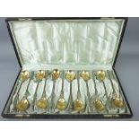 CASED SILVER SPOONS - set of twelve quality '800' silver spoons with gilt bowls and orb topped