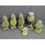 SIX RECONSTITUTED STONE GARDEN ORNAMENTS including three matching birds and a standing owl, a cone