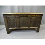 EIGHTEEENTH CENTURY OAK LIDDED CHEST, joined oak construction, the three panel front with carved