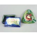 MOORCROFT - oblong deep blue ground lidded box, the lid having a rare floral pattern and with the