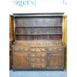 LATE 18TH CENTURY CONWY VALLEY OAK DRESSER, the shaped rack with wide back boards and five lower
