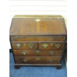 GEORGIAN CROSS-BANDED WALNUT FRONT BUREAU with interior slide open well and fitted drawer, pigeon