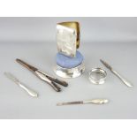 SILVER PARCEL - a lady's cigarette case, napkin ring, circular based pin cushion, three silver