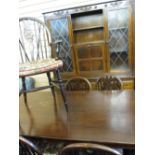 WELL PRESENTED REPRODUCTION OAK DINING SUITE of rectangular table, six (four plus two) wheelback
