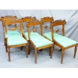 SET OF SIX REGENCY STYLE MAHOGANY DINING CHAIRS with carved crest and central rail detail and drop-