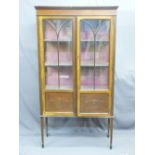 EDWARDIAN MAHOGANY TWO DOOR DISPLAY CABINET with inlaid and painted detail on tapering supports