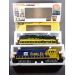 LIONEL ELECTRIC TRAINS O'GAUGE - two boxed engines, Santa Fe livery U36B, Cab No 8755 and a Seaboard