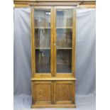 VINTAGE OAK BOOKCASE CUPBOARD with twin upper glazed doors and panelled base doors, 202cms H,