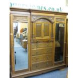SUBSTANTIAL CIRCA 1900 OAK COMBINATION WARDROBE with Art Nouveau carved detail and architectural