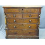 VICTORIAN MAHOGANY CHEST of six drawers with turned side pillars and wooden knobs on a plinth