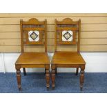 TWO EDWARDIAN OAK INSET TILE BACK HALL CHAIRS, 87cms H, 43cms W, 38cms D