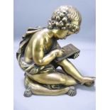 LATE 19TH CENTURY POLISHED BRONZE FIGURE of a young scribe seated upon a tasselled cushion, 16cms H